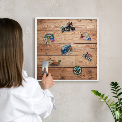 Magnetic board for travel magnets in a white frame Wooden boards