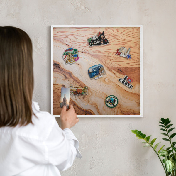 Magnetic board for travel magnets in a white frame Wooden texture