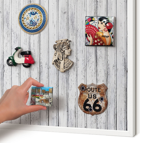 Magnetic board for travel magnets in a white frame Light wood