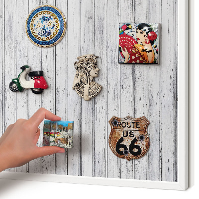 Magnetic board for travel magnets in a white frame Light wood