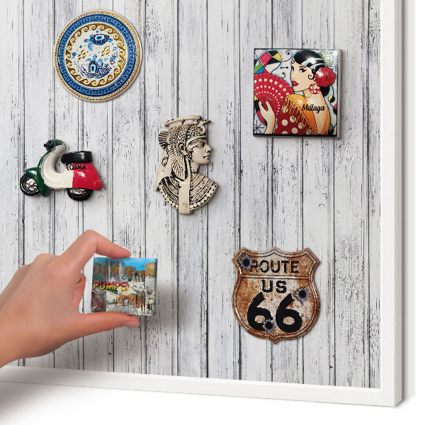 Magnetic board for travel magnets in a white frame Light wood