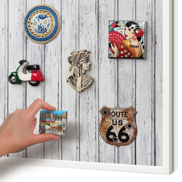 Magnetic board for travel magnets in a white frame Light wood