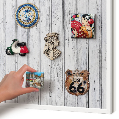 Magnetic board for travel magnets in a white frame Light wood