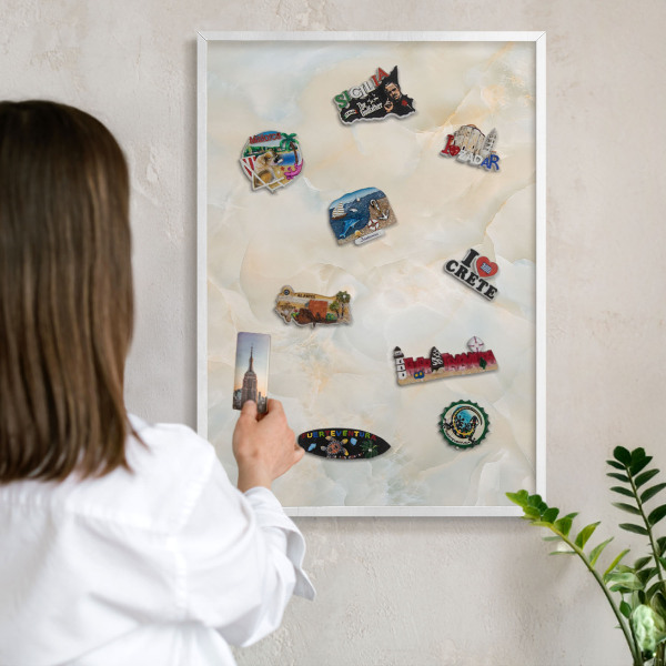Magnetic board for travel magnets in a white frame Subtle elegance
