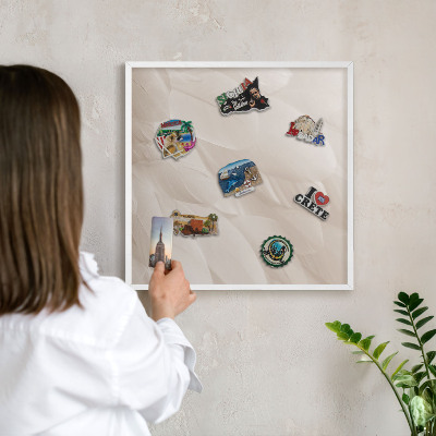 Magnetic board for travel magnets in a white frame Cream feathers