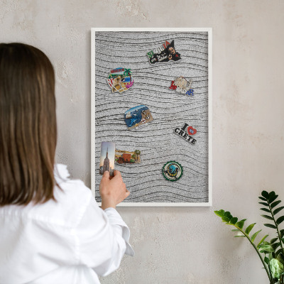 Magnetic board for travel magnets in a white frame Gray waves