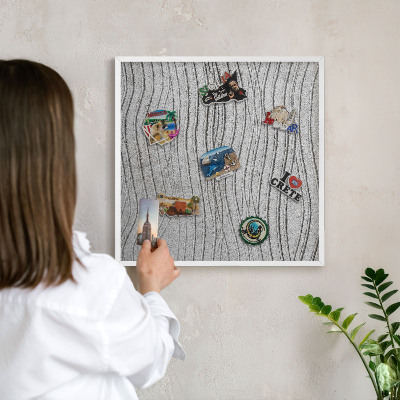 Magnetic board for travel magnets in a white frame Gray waves