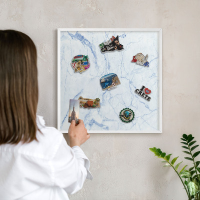 Magnetic board for travel magnets in a white frame Marble design