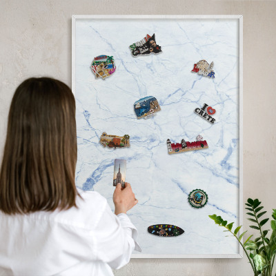 Magnetic board for travel magnets in a white frame Marble design