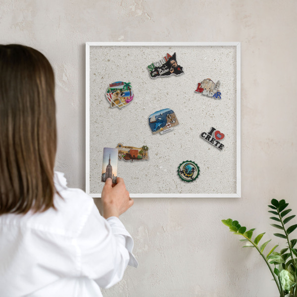 Magnetic board for travel magnets in a white frame Subtle elegance