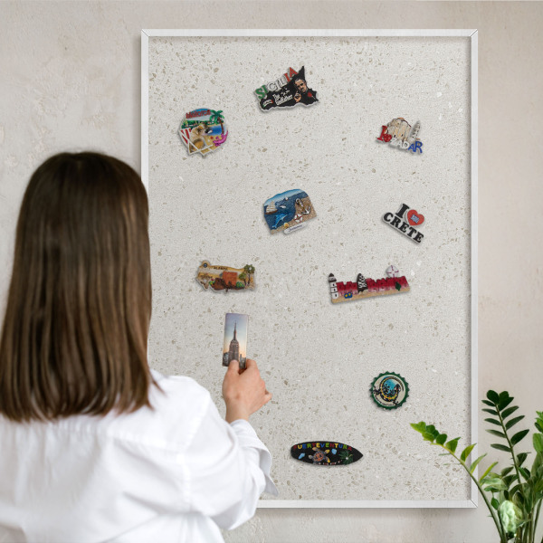 Magnetic board for travel magnets in a white frame Subtle elegance