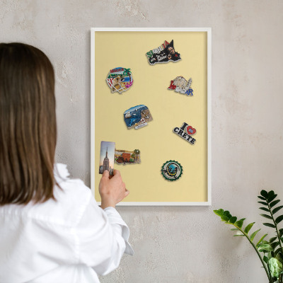Magnetic board for travel magnets in a white frame Creamy yellow
