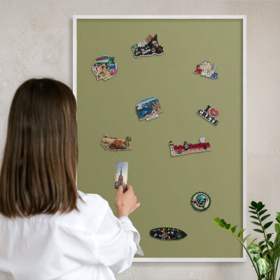 Magnetic board for travel magnets in a white frame Green grass