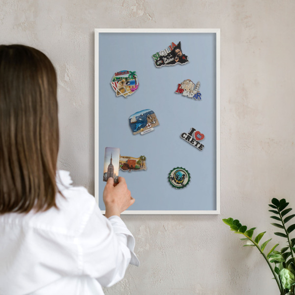 Decorative magnet board with a white frame Pastel blue