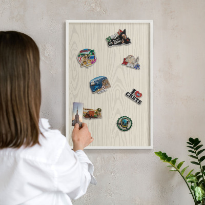 Decorative magnet board with a white frame Wooden rings