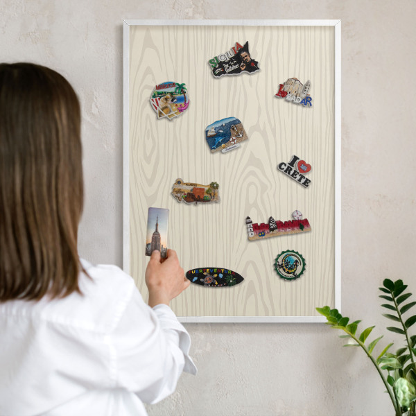 Decorative magnet board with a white frame Wooden rings