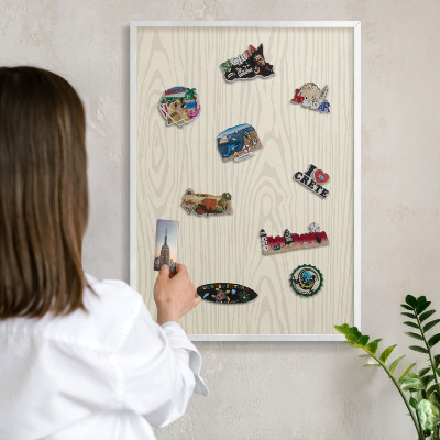Decorative magnet board with a white frame Wooden rings