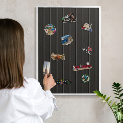Magnetic board for travel magnets in a white frame Panel texture