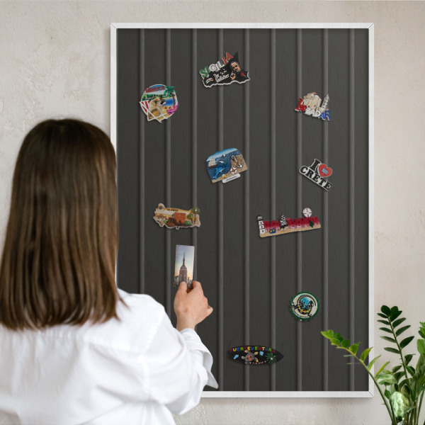 Magnetic board for travel magnets in a white frame Panel texture