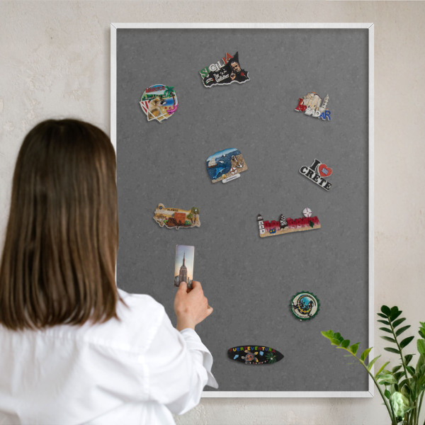 Magnetic board for travel magnets in a white frame Gray texture