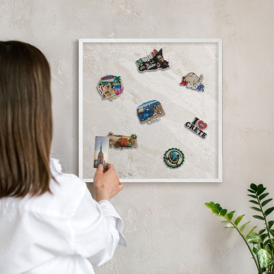 Magnetic board for travel magnets in a white frame Creamy elegance