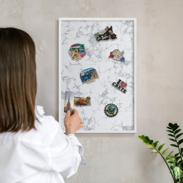 Magnetic board for travel magnets in a white frame Marble aesthetics