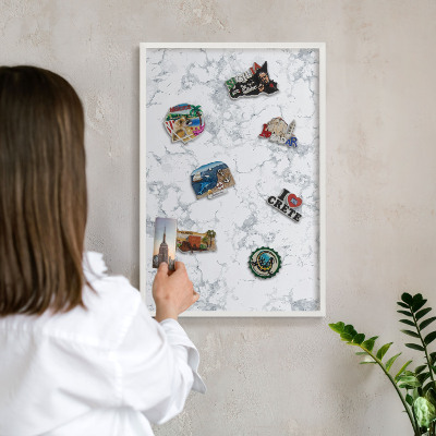 Magnetic board for travel magnets in a white frame Marble aesthetics
