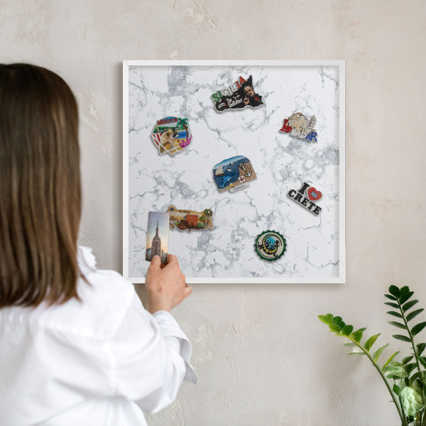 Magnetic board for travel magnets in a white frame Marble aesthetics