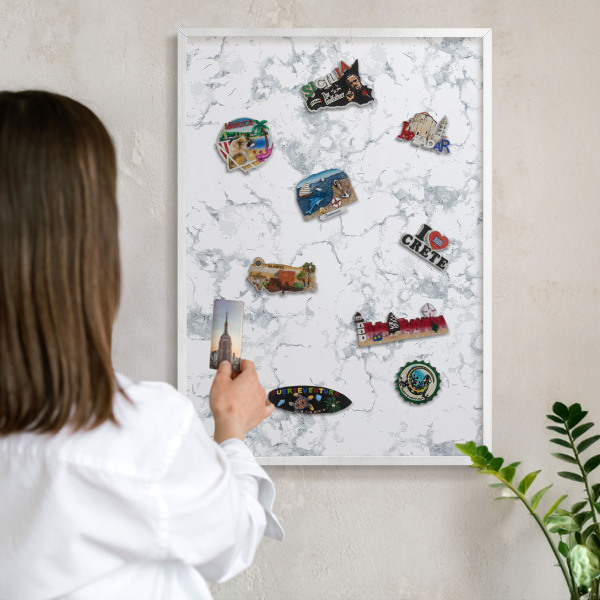 Magnetic board for travel magnets in a white frame Marble aesthetics