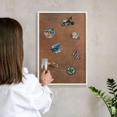 Magnetic board for travel magnets in a white frame Brown texture