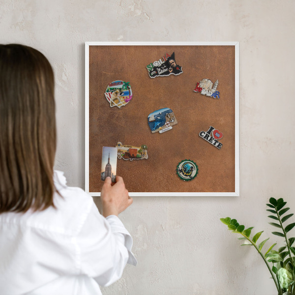 Magnetic board for travel magnets in a white frame Brown texture