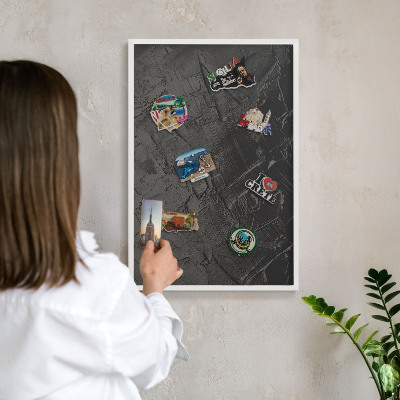 Decorative magnet board with a white frame Textured black
