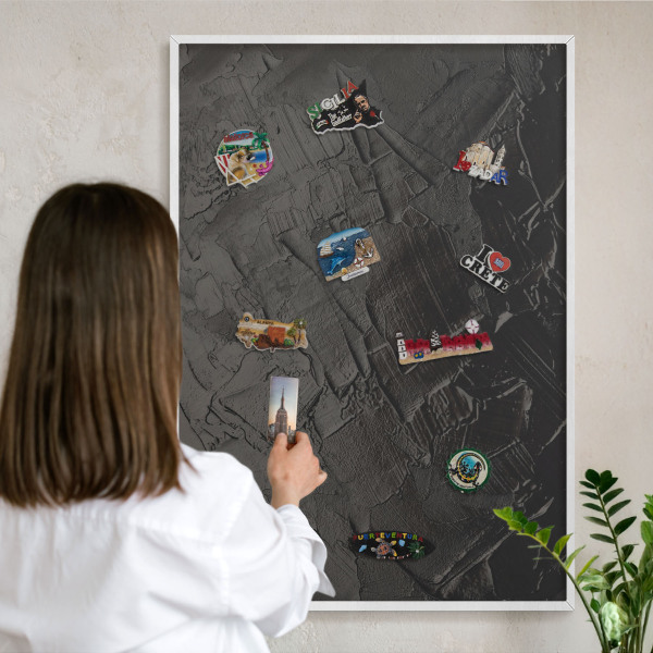 Decorative magnet board with a white frame Textured black