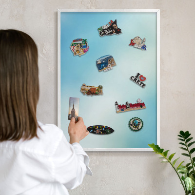 Magnetic board for travel magnets in a white frame Blue sky