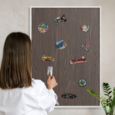 Magnetic board for travel magnets in a white frame Natural wood