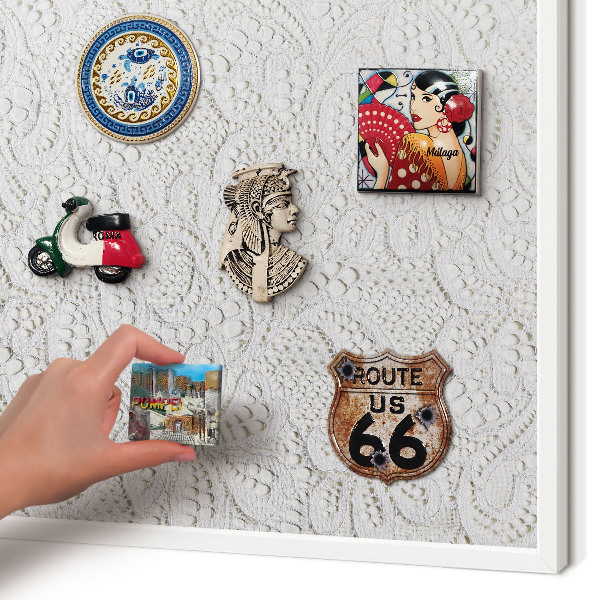 Magnetic board for travel magnets in a white frame Openwork elegance