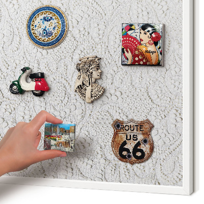 Magnetic board for travel magnets in a white frame Openwork elegance