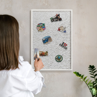 Magnetic board for travel magnets in a white frame Openwork elegance