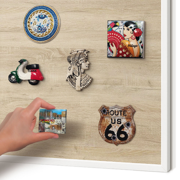 Decorative magnet board with a white frame Wooden background