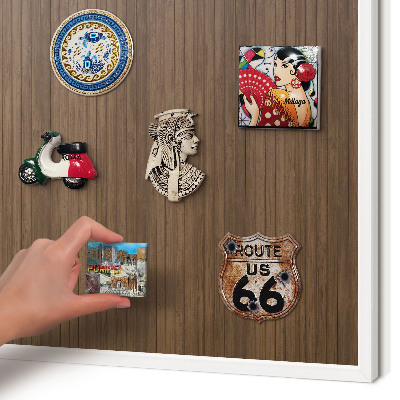 Magnetic board for travel magnets in a white frame Wooden background