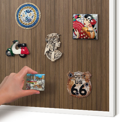 Magnetic board for travel magnets in a white frame Wooden background