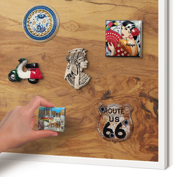 Magnetic board for travel magnets in a white frame Natural wood