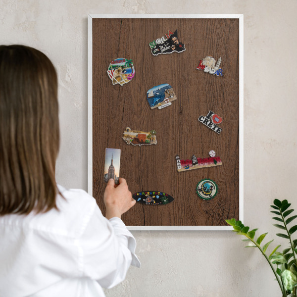Magnetic board for travel magnets in a white frame Wooden texture