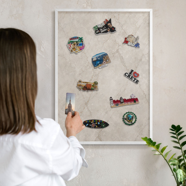 Magnetic board for travel magnets in a white frame Natural elegance