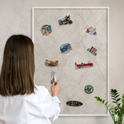 Magnetic board for travel magnets in a white frame Natural elegance