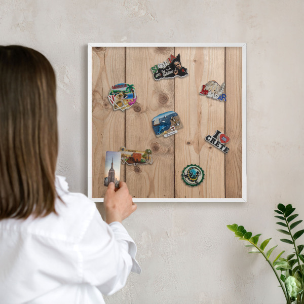 Magnetic board for travel magnets in a white frame Wooden texture