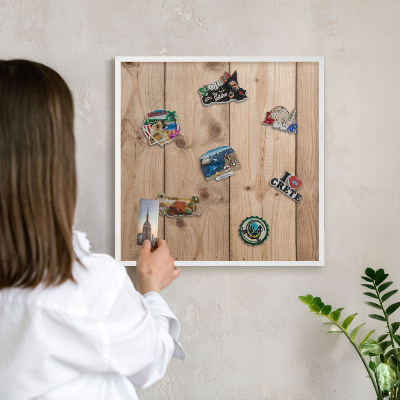 Magnetic board for travel magnets in a white frame Wooden texture
