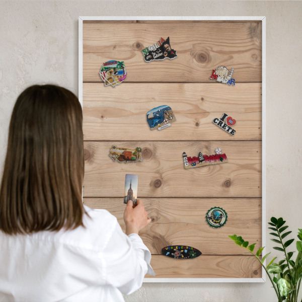 Magnetic board for travel magnets in a white frame Wooden texture