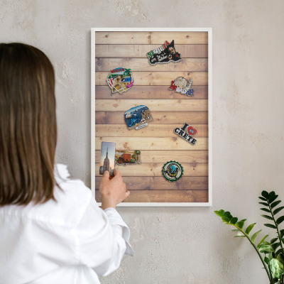 Magnetic board for travel magnets in a white frame Wooden boards