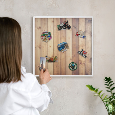 Magnetic board for travel magnets in a white frame Wooden boards
